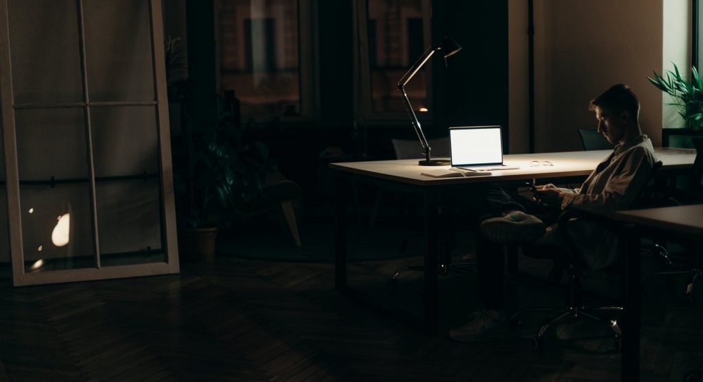 silver macbook on white table